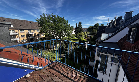 Charmante lichtdurchflutete  Eigentumswohnung mit Dachterrasse in Südlage