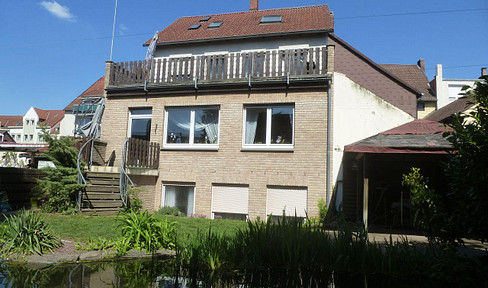 Sunny 3-room apartment, with terrace, garden, and garage.