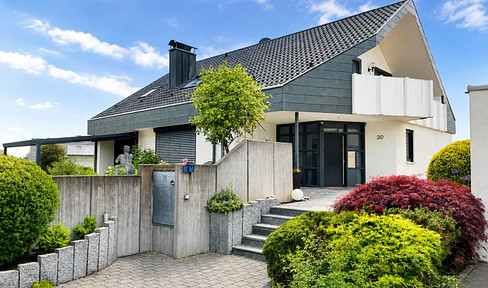 Modernized two-family house with an additional living area.