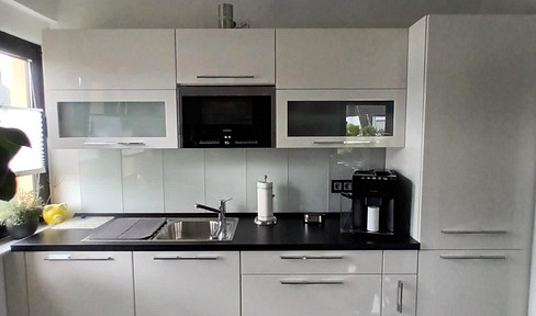 2-room apartment with a balcony, parking space, fitted kitchen, large garden, and a private cellar.