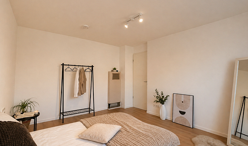 Spacious 3.5-room apartment with balcony and parking space, located in a quiet residential area.