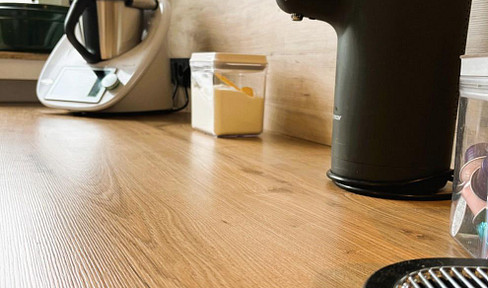 Completely renovated, air-conditioned attic apartment with a south-facing balcony, offering potential for conversion into two separate units, located in Essen-Haarzopf.