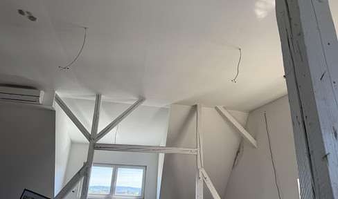 Partially renovated attic apartment for sale due to a heart attack.