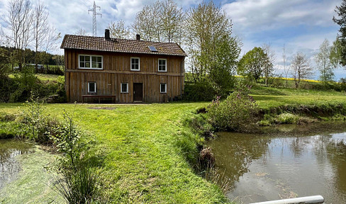 Rare opportunity: Property with a house, 4 ponds, and water rights, located in a secluded area.