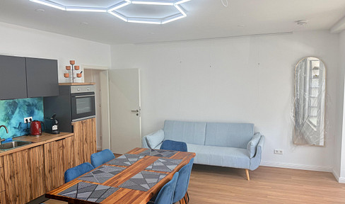 First occupancy of an exclusive, renovated, and furnished 2-room apartment on the ground floor in the center of Erlangen.