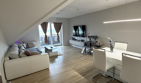 3-room attic apartment with garden and parking space.