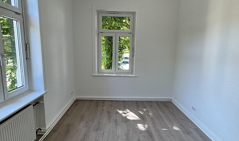 Beautiful four-room apartment in a building constructed with white brick.