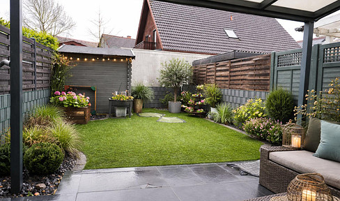 Modern townhouse with a sunny garden and a double garage.