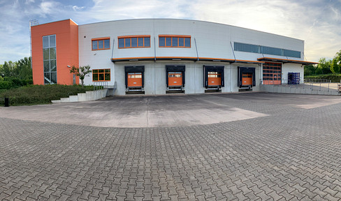 3100 square meter warehouse with truck loading ramps and a staff area.