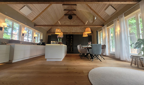 A unique and idyllic living space with historical charm, featuring a detached house and a thatched-roof house.