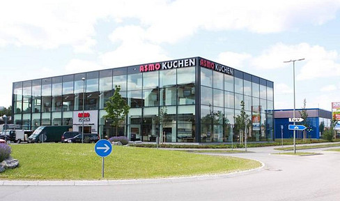 High-quality commercial space available for sublease in the Unterhaching industrial area, offered by ASMO Küchen GmbH.