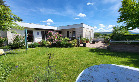 Architect-designed house in a quiet, hillside location, with a separate office/practice area (suitable for use as a separate living unit).