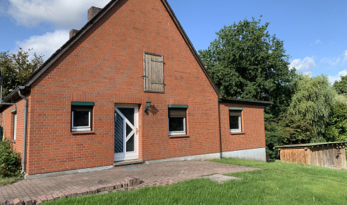 Semi-detached house with potential for further development.