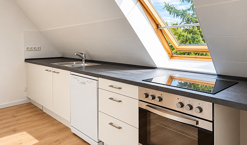 Bright and spacious 2-room attic apartment with a new fitted kitchen, located in Berlin-Grünau.