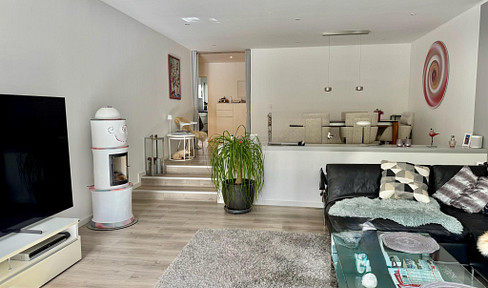 High-quality renovated four-room garden apartment with a private, secluded garden.