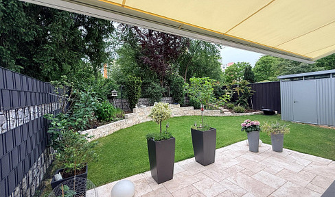 High-quality renovated four-room garden apartment with a private, secluded garden.
