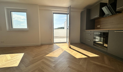 Brand new gem in a south-facing location: Exclusive 75 m² apartment with a stunning view of the green landscape.
