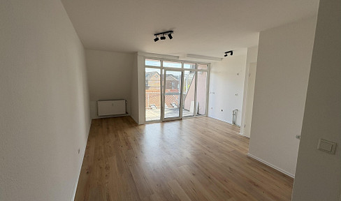 Modern 1-bedroom apartment with balcony and underground parking space for rent in St. Tönis.