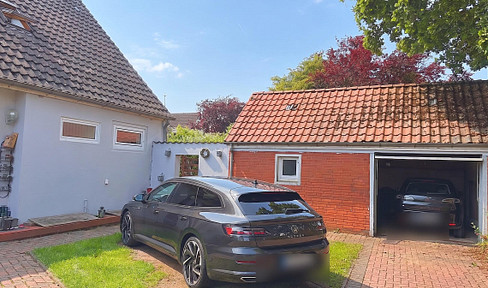 Arriving in Bern: A detached house with a garden, pool, and plenty of space to grow, including a garden area.