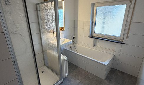 3-room apartment, 87 square meters, with a balcony, garage, and large storage room, located in Hohberg-Niederschopfheim.