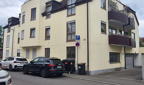 Modern 2-room apartment with balcony, cellar, and garden.