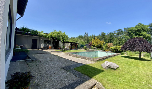Dreamlike, detached two-family house with a view of the forest, featuring a pool, sauna, and a prime location.