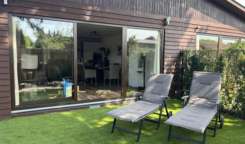 Half of a bungalow, with its own sunny garden and a covered terrace.