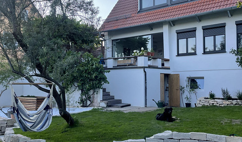 Sun-drenched detached house with a garden, located in a quiet residential area.