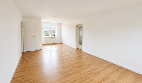 Spacious 3-room apartment with 2 bathrooms, a balcony, and a parking space.