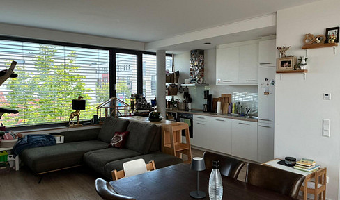 Modern 2-room apartment with fitted kitchen.