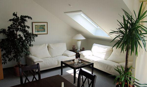 Spacious 4.5-room attic apartment on two levels, with 2 balconies, in a quiet location.