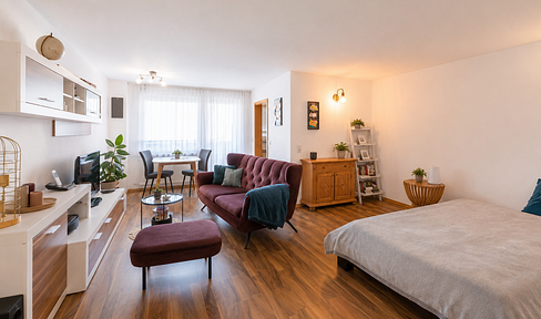 High-quality 1.5-room apartment with a large balcony, elevator, and underground parking.