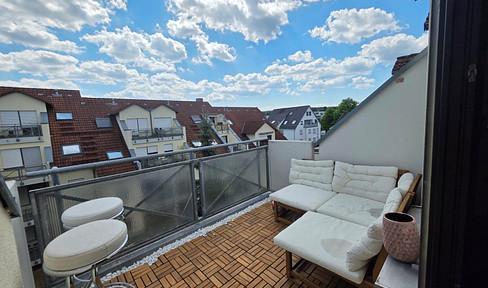 High-quality renovated, partially furnished 2.5-room apartment with a balcony and parking space in a garage, located in Böblingen.