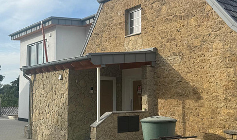 Ländliche Ruhe trifft moderne Eleganz-Exklusive Neubauwohnung im ersten Obergeschoss