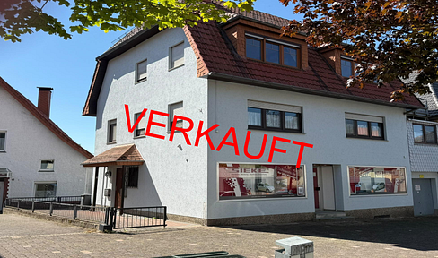 Investment property with 2 residential units, commercial space, and development potential.