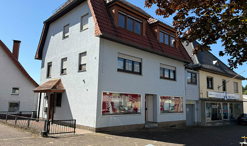 Investment property with 2 residential units, commercial space, and development potential.