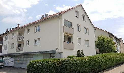 Well-maintained 3-room apartment with parking space and fitted kitchen, located in a quiet residential area.