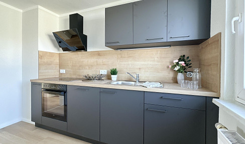 Rented 3-room apartment with fitted kitchen and south-facing balcony – Investment property in Bützow.
