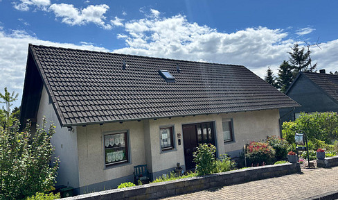 Spacious detached house with a separate apartment, garden, and views.
