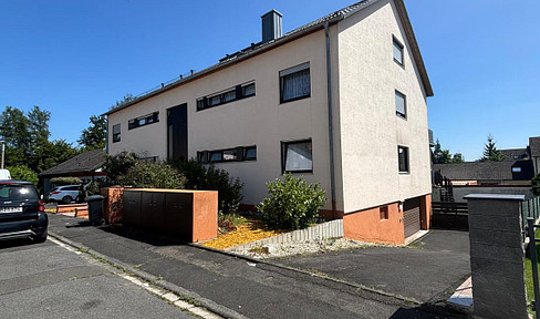 Bright, partially furnished 4-room ground-floor apartment with a balcony and garage, located in Haibach.