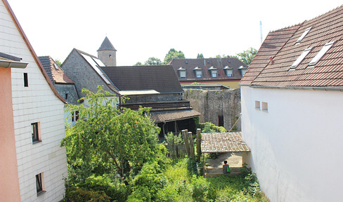 Building plot with existing structures in a unique, historic city center location.