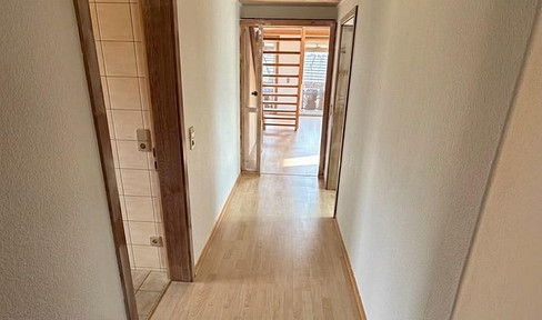 3-room attic apartment with a gallery, balcony, and garage.