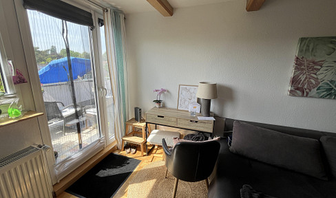 2.5-room attic apartment with a large balcony and views of greenery, located in Bochum-Harpen.