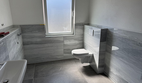 First occupancy: Bright 2-room apartment with a garden, garage, and underfloor heating.
