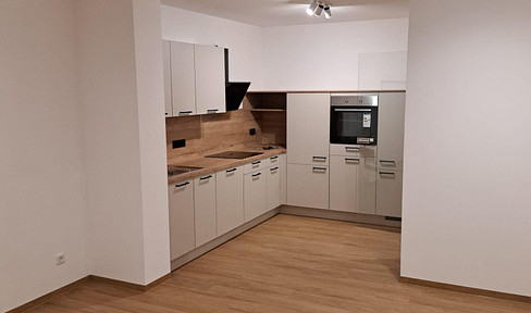 New construction - Never occupied before - Beautiful 2-room apartment including fitted kitchen and underground parking space!