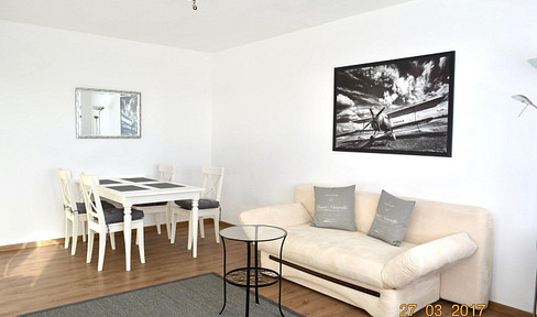 Bright, fully furnished 2.5-room apartment with an underground parking space, located in a central area of Munich-Laim.