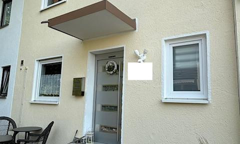 Well-maintained semi-detached house with a balcony, terrace, and small garden.