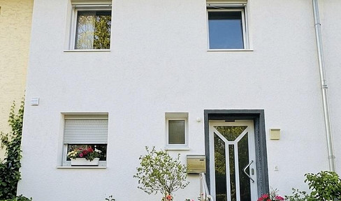 Well-maintained terraced house in a quiet location, with a garden and garage.