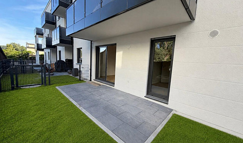 FIRST OCCUPANCY - 2-room apartment with southwest-facing terrace and garden, fitted kitchen, private storage room, and electric blinds.