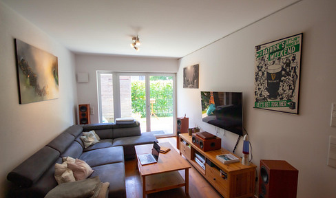 Modern 2-room ground floor apartment with a terrace, high-quality fitted kitchen, and an underground parking space.